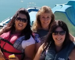 My friend (navy blue Cabela's life jacket), her friend (red life jacket), and I rented a paddle boat at Palisade Lake near Sterling, Utah in Aug 2019.