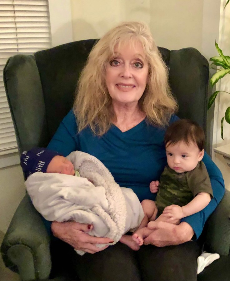 I’m in seventh heaven here holding two of my grandbabies.
