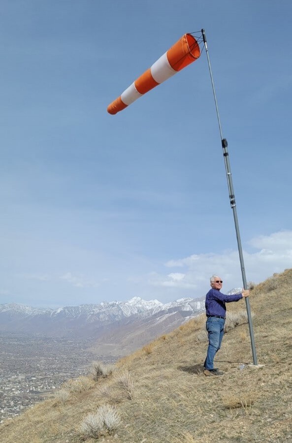 Facing into a 40 mph wind, hang gliding point above the Bonneville Shoreline Trail, March 2021