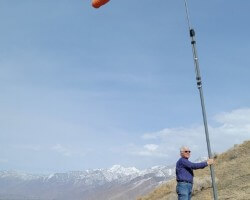 Facing into a 40 mph wind, hang gliding point above the Bonneville Shoreline Trail, March 2021